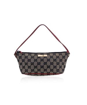 VINTAGE, RRP AS NEW
Elegant in its simplicity, this beautiful Gucci boat-shaped shoulder bag is a refined classic from the house's timeless archive. Crafted in beige monogram canvas with red leather trim, its gently curved silhouette recalls the effortless sophistication of late '90s and early 2000s Italian design. The top zipper closure opens to reveal a black canvas lining.  Inside, you'll find the unmistakable GUCCI - Made in Italy tag, with the serial number neatly printed on the reverse-a subtle but essential mark of ity. Designed for everyday elegance, the shape hugs comfortably under the arm, making it as practical as it is chic.  This is a piece for true lovers of vintage luxury: understated, beautifully made, and ready to sail smoothly into your modern wardrobe. Condition Rating: B - VERY GOOD CONDITIONCondition Details: Some normal wear of use on red leather parts. Light surface scratches on the front GUCCI logo tab. Minimal wear of use on the internal lining. Please, look carefully at the photos and ask for any detail.Measurements (cm):Depth: 7.6Height: 11.4Length: 26.7Other Details: Dustbag? NoKeys? NoBox? No Measurments:  width: 76 mm length: 267 mm height: 114 mm strap length: 0 mm handle drop: 0 mm