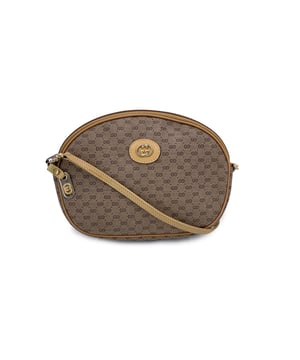 VINTAGE, RRP AS NEW
A charming nod to classic Italian design, this lovely small Vintage Gucci crossbody bag is a perfect blend of heritage and everyday elegance. Crafted in Gucci's signature beige monogram canvas with rich tan leather trim, it's a piece that carries the legacy of understated luxury.  The gold-tone GG logo gleams on the front-instantly recognizable and forever iconic. A top zipper opens to a simple, functional canvas-lined interior, just the right size for your essentials. The shoulder strap is removable, giving you the freedom to style it as a crossbody, a handheld pouch, or even to tuck inside a larger tote.  Inside, the 'GUCCI Italy' hallmark confirms its craftmanship and storied past. Compact, versatile, and effortlessly stylish, this vintage gem is more than a bag-it's a piece of Gucci history ready to be carried into a new chapter. Condition Rating: B - VERY GOOD CONDITIONCondition Details: Some wear of use on leather trim. The shoulder strap shows some black marks. Minimal wear of use on the internal lining. Please check the photos carefully and ask if you need to know more details or if you have any doubts.Measurements (cm):Depth: 5.1Height: 16.5Length: 22.9Other Details: Dustbag? NoKeys? NoBox? No Measurments:  width: 51 mm length: 229 mm height: 165 mm strap length: 0 mm handle drop: 0 mm
