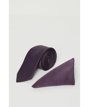 Sleek tie with matching pocket square for coordinated formal styling
        Classic slim design tie with subtle sheen for sophisticated occasions
        Triangular pocket square adds a refined touch to any suit jacket
        Burton branded detailing for authentic quality assurance
        Versatile accessory set suitable for various formal and smart-casual events
    
    Complete your formal ensemble with this sophisticated Burton tie and pocket square set. The slim-profile tie offers a contemporary silhouette that pairs perfectly with the coordinating pocket square for a polished, put-together appearance. As shown, this set complements a light-coloured suit brilliantly, creating a smart contrast that commands attention without overwhelming. Perfect for weddings, important meetings, or evening gatherings at upscale venues, this versatile accessory duo allows for multiple styling options. Tuck the pocket square with a classic peak fold for traditional occasions, or experiment with more relaxed arrangements for smart-casual events. Machine washable for convenient care, this practical yet stylish set is an essential addition to any gentleman's wardrobe, offering that finishing touch that transforms a simple suit into a complete, thoughtful outfit worthy of any sophisticated gathering.