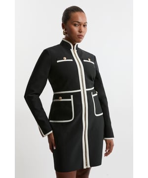 Feel elegant in our plus size mini dress, with a figure hugging silhouette, trim detailing, and contrasting metallic hardware. Style this dress with tiights and heels for an outfit that will turn heads from office days to upcoming occasions and events. Plus Size Figure Form Bandage Knit Piping Detail Military Dress High Quality Knit Fabric Contrasting, Piped Detailing Metallic Hardware Accents Flattering Fit and Flare Silhouette Formal High Neckline Bodycon Silhouette Zip Front Fastening Expertly designed for those UK size 18/US size 14 and above, our plus size clothing collection is perfectly proportioned to ensure you look stylish at every shape.Discover our collection of plus size dresses or browse our range of plus size clothing now.