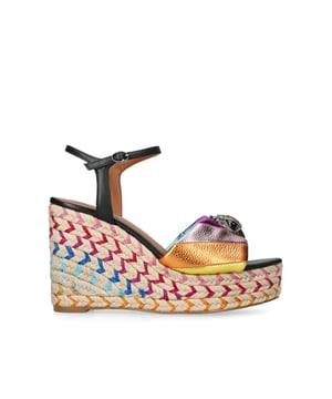 The Kensington Espadrille, an addition to the iconic Kensington collection, is crafted in a pebble grain cow leather in the iconic rainbow sewn stripe pattern. The rope wedge heel features rainbow thread running through the heel. Heel height: 10.5cm.