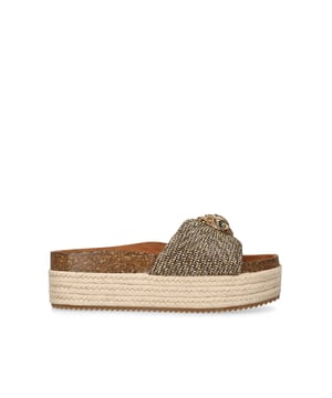 The Kensington Flatform, an addition to the Kensington Collection, features a houndstooth strap embellished with gold crystals. The gold Eagle head features crystals and black crystal eyes on the strap. Sole height: 4cm.