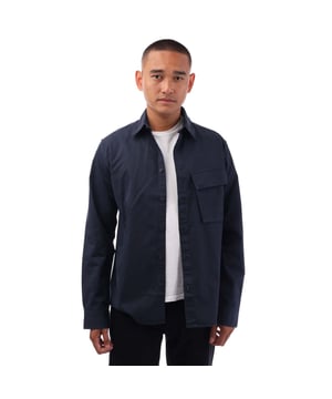 Point collar.Long sleeve.Centre front button fastening.Signature tilted flap pocket.Adjustable buttoned cuff.Belstaff Phoenix patch on sleeve.Garment-dyed cotton twill.