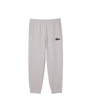 Materiaal: Biologisch katoen. Stof: Fleece, Ongeborsteld. Ontwerp: Geborduurd logo. Elastische enkels. Zakken: 2 Zijzakken, Rits. Waistline: Elastiek. Pasvorm: Relaxed model.