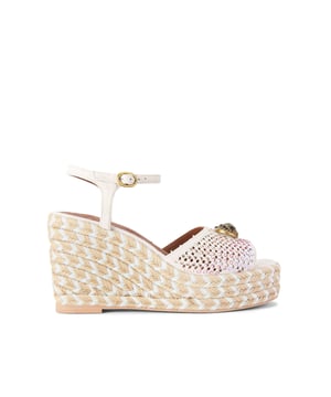 This KG Kurt Geiger Chelsea Wedge is a wedge heel crafted in a bone suede fabric. There is an antiqued brass oval trim with crystal eagle head at the centre of the multi-colour crystal strap. Heel height: 9.5cm.
