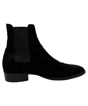 VINTAGE, RRP AS NEW
The Saint Laurent Wyatt Chelsea Boots in black suede are the epitome of sleek sophistication, crafted in Italy with a slim silhouette and signature Cuban heel for a sharp, modern edge. Their premium suede finish and subtle elastic side panels make them a versatile staple for elevated everyday wear. **Style tip:** Pair these boots with slim black jeans and a tailored leather jacket for an effortlessly cool, rock-inspired look.

Saint Laurent Wyatt Chelsea Boots in Black Suede

Condition: Very good
Signs of wear: Lightly used but very well maintained. Minor mark at soles & creasing, light scuffing at the soles and heels.
Packaging: None
Color: Black
Material: Suede | suede
Size: IT | 40
Measurements: Heel height: 30 mm; Insole length: 290 mm
SKU: MRPPUGBSH526883M