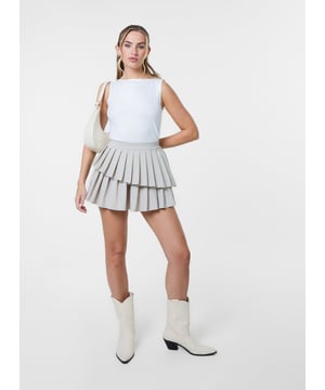 Be extra in our Pleated Asym Mini Skirt. This pleated mini skirt gives both edgy and chic vibes. Style it with a cute bardot top.