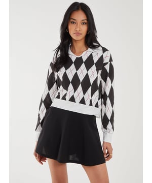 Just the perfect school girl fit but make it cool. Make a statement in this argyle pattern top.