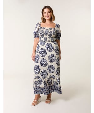 This dress is a must have in your holiday suitcase. This stunning printed maxi in refreshing pastel shades provides nothing but elegance. Match with sunny sandals.