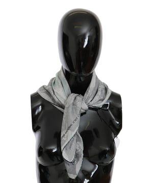 100% silk scarf from CNC Costume National
  Gray printed design
  Logo details
  Made in Italy
  Dimensions: 65cm x 65cm
  Suitable for women
Material: 100% Silk