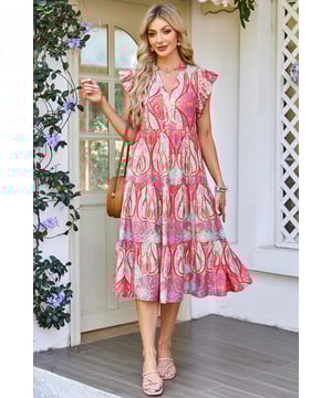 Elegante vestido midi con vibrante estampado tribal de paisley floral  
Mangas con volantes para un toque juguetón y femenino  
Escote en forma de pico para un detalle moderno y sofisticado  
Tejido suave y fluido para comodidad y libertad de movimiento  
Material: 84% Viscosa 16% Poliamida