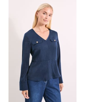 Elegant satin V-neck blouse with flattering peplum silhouette
        Decorative button-detail pockets add sophisticated visual interest
        Long sleeves with neat cuffs for a polished finish
        Versatile regular fit that complements various body shapes
        Smooth, lustrous fabric creates a refined drape and subtle sheen
    
    This Principles satin blouse combines practicality with sophistication through its thoughtfully designed pocket details and feminine peplum shape. The V-neckline frames the dcolletage beautifully, while the regular fit ensures comfort without compromising on style. Perfect for special occasions, this versatile piece can be styled with tailored trousers and court shoes for formal events, or dressed down with wide-leg denim as shown for smart-casual settings. The lustrous fabric catches the light subtly as you move, adding dimension to your ensemble. For evening affairs, accessorise with statement earrings and a structured clutch; for daytime sophistication, pair with a tote bag and ankle boots as styled on our model. This blouse transitions effortlessly from office to evening with simple accessory changes, making it an indispensable addition to your wardrobe.