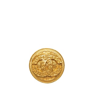 This brooch features a gold-tone metal body and a back pin closure.Brand: Chanel VintageCondition: PrelovedType: Costume BroochRating: ABMain Material: MetalDimensions (LxWxD): 4.5x4.5x0Comments: Exterior Back Scratched. Lock Rusty/Tarnished Scratched. Exterior Front Discolored Scratched.