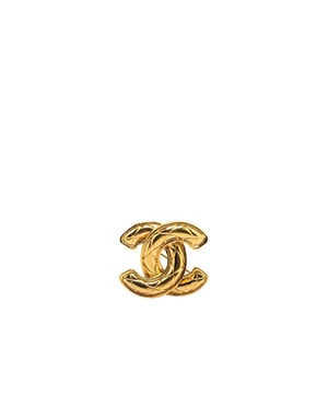 This brooch features a quilted gold-plated body and a back pin closure.Brand: Chanel VintageCondition: PrelovedType: Costume BroochRating: B+Main Material: MetalDimensions (LxWxD): 3.4x4x0Comments: Exterior Back Scratched. Exterior Back stained with Other. Lock Scratched. Exterior Front Scratched.