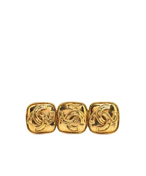 This brooch features a gold-tone metal body and a back pin closure.Brand: Chanel VintageCondition: PrelovedType: Costume BroochRating: B+Main Material: MetalDimensions (LxWxD): 2.3x7x0Comments: Exterior Back Scratched. Lock Scratched. Exterior Front Scratched.