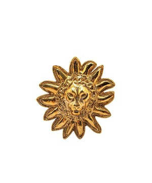 This brooch features a gold-plated metal body and back pin closure.Brand: Chanel VintageCondition: PrelovedType: Costume BroochRating: B+Main Material: MetalDimensions (LxWxD): 5.2x4.9x0Comments: Exterior Back Scratched. Lock Scratched. Exterior Front Scratched.