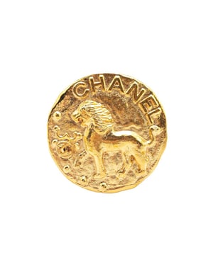 This brooch features a gold-plated metal body and a back pin closure.Brand: Chanel VintageCondition: PrelovedType: Costume BroochRating: B+Main Material: MetalDimensions (LxWxD): 5x5x0Comments: Exterior Back Scratched. Exterior Back stained with Other.