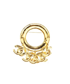 This brooch features a gold-tone metal body CC charms and a back pin closure.Brand: Chanel VintageCondition: PrelovedType: Costume BroochRating: B+Main Material: MetalDimensions (LxWxD): 6.5x7.5x0Comments: Exterior Back Discolored Scratched. Lock Scratched. Exterior Front Scratched.