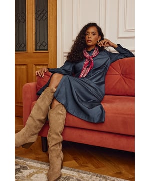 Sophisticated maxi shirt dress with full-length button fastening
        Classic collared neckline with elegant pointed design
        Long sleeves with neat button cuffs for adjustable comfort
        Defined waistline creates a flattering feminine silhouette
        Flowing maxi length with graceful movement when walking
    
    This versatile denim-look shirt dress from Wallis combines timeless sophistication with everyday comfort. The structured collar and full button-through design create a polished appearance, whilst the defined waistline adds shape to the flowing maxi silhouette. Style with ankle boots and a tonal handbag as seen on our model for casual daywear, or dress down further with white trainers and a crossbody bag for weekend shopping trips. Perfect for family gatherings or lunch with friends, this dress transitions effortlessly from season to season with simple accessory changes. Add a lightweight cardigan and scarf when temperatures drop, or wear open over a camisole and trousers for a contemporary layered look. The woven fabric drapes beautifully whilst maintaining its shape throughout the day.