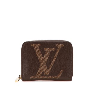 This coin purse features a monogram giant canvas body a zip-around closure and interior slip compartments.Brand: Louis Vuitton VintageCondition: PrelovedType: Coin PouchRating: ABMain Material: CanvasDimensions (LxWxD): 8.5x11x2Dust Bag: YesComments: Exterior Corners Worn. Interior Lining Worn. Interior Lining stained with Other. Exterior Top Worn. Zipper Scratched.