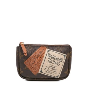 The Pochette Cles features a printed monogram canvas body and a top zip closure.Brand: Louis Vuitton VintageCondition: PrelovedType: Coin PouchRating: B+Main Material: CanvasDimensions (LxWxD): 9.5x15x3Handle Drop: 13Comments: Interior Lining Loose Stitching. Practical Attachment Scratched. Exterior Top Loose Stitching. Zipper Rusty/Tarnished.