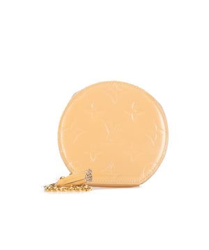 This coin pouch features a monogram vernis leather body a top zip closure and a gold-tone chain link strap with a leather tassel.Brand: Louis Vuitton VintageCondition: PrelovedType: Coin PouchRating: B+Main Material: LeatherDimensions (LxWxD): 10x11x1.5Dust Bag: YesComments: Exterior Bottom stained with Other. Embellishment Scratched. Interior Lining Scratched. Interior Lining stained with Other. Zipper Scratched.