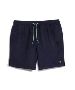 Mens Farah Colbert Swim Shorts in true navy- Elastic waistband with an adjustable drawstring.- Two side pockets.- Back pocket.- Embroidered branding to the hem.- Mesh lining.- Regular fit.- 100% recycled polyester.  Machine washable.- Ref: F4SMB039412
