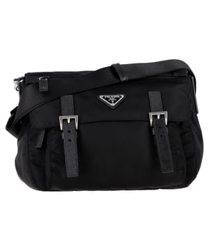VINTAGE, RRP AS NEW
Modern and eco-conscious, the Prada Re-Nylon Satchel Shoulder Bag in black polyamide combines sleek design with sustainable innovation. Lightweight, durable, and water-resistant, it features the iconic enameled triangle logo and multiple compartments for everyday functionality. **Style tip:** Wear it with an oversized blazer and chunky boots for a cool, utilitarian edge that blends fashion with practicality.

Prada Re-Nylon Satchel Shoulder Bag in Black Polyamide

Condition: Excellent
Signs of wear: No retail tag, No visible sign of wear., 
Packaging: None
Color: Black
Material: Polyamide
Size: One Size | One Size
Measurements: Width: 90; Height: 240; Length: 280
SKU: NAPPUGBBA527500W