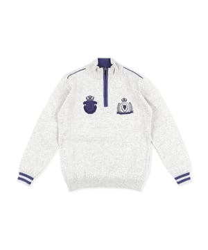 Wool turtle neck with zip. Embroidered crests. Ribbed collar, cuffs and bottom.