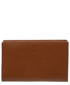 The 'Isadora' purse from NiNa Amora is a elegant bi-fold design which is crafted from natural leather with a soft to the touch and smooth finish. This classic design is secured with a press stud fastener which opens to reveal seven card slots and a mesh ID slot; ample space for all your essentials. Additional storage space is provided by four slip pockets and a zipped dual pocket which are ideal for notes, receipts and change. The NiNa Amora logo is blind embossed both on the exterior and interior for an elegant finishing touch.