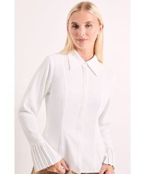 Elegant pleated cuff detailing adds a distinctive touch to this sophisticated shirt
        Feminine peplum silhouette creates a flattering waistline definition
        Classic collared neckline offers timeless versatility for various styling options
        Regular fit ensures comfortable wear throughout the day
        Long sleeves with architectural pleating provide a contemporary design element
    
    This Principles peplum shirt combines classic tailoring with modern details for effortless daywear sophistication. The structured collar frames the neckline beautifully, while the pleated cuff detailing adds architectural interest to the sleeves. The peplum silhouette creates a naturally defined waistline that flatters your figure without compromising on comfort. Style with wide-leg trousers as shown for a balanced silhouette perfect for family gatherings or weekend brunches. For casual office days, pair with tailored cigarette trousers and ballet flats. The versatile design transitions seamlessly from day to evening - simply swap your day bag for a clutch and add statement earrings for dinner with friends. This shirt works brilliantly as a layering piece under jumpers during cooler months, with the pleated cuffs and collar adding visual interest.