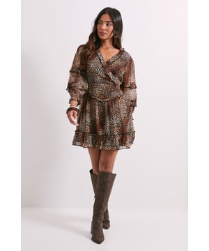 Flattering wrap front design with V-neckline for a feminine silhouette
        Playful ruffle trim detailing adds movement and dimension
        Tiered mini skirt with delicate frills for a flirty finish
        Statement long sleeves with elegant ruffle layers
        Petite fit designed specifically for frames 5'3" and under
    
    This Dorothy Perkins mini dress combines casual charm with eye-catching animal print for effortless style. The wrap front design creates a flattering silhouette while the ruffle trim adds a playful touch to your look. Perfect for weekend brunches with the girls, pair with knee-high boots as shown for a trendy autumn ensemble, or dress down with white trainers and a denim jacket for family gatherings. The lightweight woven fabric offers comfortable wear throughout the day, while the mini length keeps the look fresh and modern. For cooler weather, layer with a chunky cardigan and tights, or add a leather jacket for evening drinks. This versatile piece transitions seamlessly from daytime casual to evening meet-ups with a simple change of accessories.