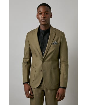Crafted from a cotton-linen blend fabric for breathable comfort and a refined texture
        Slim fit design offers a contemporary silhouette that defines the shoulders and chest
        Two-button fastening with notched lapels for classic tailoring appeal
        Patch pockets add a relaxed touch to this smart jacket
        Versatile piece that transitions seamlessly from office to social occasions
    
    This Burton suit jacket combines timeless style with modern tailoring for the discerning gentleman. The cotton-linen blend creates a lightweight feel with natural texture, perfect for year-round wear. The slim fit construction shapes a sharp silhouette without sacrificing comfort, tapering through the waist for a defined look that sits close to the body. Style as seen with a black shirt for a contemporary twist on formal attire, or pair with a crisp white shirt and patterned pocket square for traditional occasions. The jacket works brilliantly for summer weddings, garden parties or smart office environments. For casual sophistication, team with dark denim jeans and Chelsea boots. Dry clean only to maintain the jacket's clean lines and structured appearance.