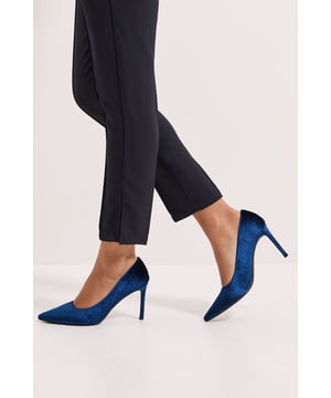 Luxurious velvet court shoes with an elegant pointed toe design
        Sleek stiletto heel measuring between 7-9cm for a sophisticated silhouette
        Versatile style that complements both daywear and evening attire
        Soft velvet texture adds a touch of opulence to any ensemble
        Classic slip-on design for effortless elegance and ease of wear
    
    The Dorothy Perkins Dash Velvet Pointed High Stiletto Heel Court Shoes offer timeless sophistication with modern appeal. The sumptuous velvet finish creates a rich textural contrast when paired with flowing fabrics, as shown styled with a graceful tiered skirt. These court shoes strike the perfect balance between comfort and elegance, making them ideal for special occasions from weddings to graduation ceremonies. For formal events, pair with a tailored dress or a chic jumpsuit for a polished look. The pointed toe elongates the leg whilst the 7-9cm heel height provides a confident boost without sacrificing wearability. These versatile heels transition seamlessly from day to evening, allowing you to maintain your elegant style from an afternoon at the races to evening cocktails. A wardrobe essential that delivers refined glamour for the woman who appreciates subtle yet striking style.