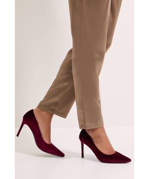 Luxurious velvet court shoes with an elegant pointed toe design
        Sleek stiletto heel measuring between 7-9cm for a sophisticated silhouette
        Versatile style that complements both daywear and evening attire
        Soft velvet texture adds a touch of opulence to any ensemble
        Classic slip-on design for effortless elegance and ease of wear
    
    The Dorothy Perkins Dash Velvet Pointed High Stiletto Heel Court Shoes offer timeless sophistication with modern appeal. The sumptuous velvet finish creates a rich textural contrast when paired with flowing fabrics, as shown styled with a graceful tiered skirt. These court shoes strike the perfect balance between comfort and elegance, making them ideal for special occasions from weddings to graduation ceremonies. For formal events, pair with a tailored dress or a chic jumpsuit for a polished look. The pointed toe elongates the leg whilst the 7-9cm heel height provides a confident boost without sacrificing wearability. These versatile heels transition seamlessly from day to evening, allowing you to maintain your elegant style from an afternoon at the races to evening cocktails. A wardrobe essential that delivers refined glamour for the woman who appreciates subtle yet striking style.