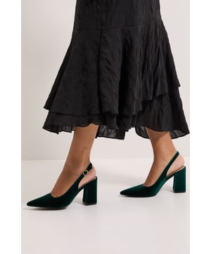 Luxurious velvet finish that adds texture and sophistication to any outfit
        Elegant pointed toe design for a flattering, leg-lengthening effect
        Comfortable high block heel measuring between 7-9cm for stability and style
        Practical slingback strap with adjustable buckle fastening for a secure fit
        Versatile court shoe silhouette that transitions effortlessly from day to evening wear
    
    The Ellens Velvet Slingback Court Shoes combine timeless elegance with modern practicality. The sumptuous velvet texture creates a rich visual appeal whilst the pointed toe elongates the silhouette beautifully. Style these sophisticated heels with tailored trousers as shown for a polished workwear ensemble, or pair with a pencil skirt for important meetings. The sturdy block heel offers comfort for all-day wear, making these shoes ideal for formal occasions such as weddings and graduations where you'll be on your feet. For evening events, match with a sleek midi dress or elegant jumpsuit. The slingback design provides security whilst maintaining a refined aesthetic, perfect for the Dorothy Perkins woman who values both style and comfort in her wardrobe staples.