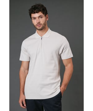 Textured stripe pattern adds subtle visual interest to this classic polo design
        Quarter-zip neck detail offers versatile styling options and a contemporary twist
        Comfortable cotton fabric ensures breathability for all-day wear
        Neat collar with ribbed finish maintains its shape throughout the day
        Relaxed short sleeves provide ease of movement for casual activities
    
    This Burton textured stripe polo combines timeless appeal with modern detailing, perfect for the man who appreciates classic style with a contemporary edge. The quarter-zip neck allows you to customise your look throughout the day, whether partially unzipped for a relaxed pub lunch or fully zipped for a smarter finish. Pair with dark trousers as shown for an effortlessly smart-casual ensemble that works brilliantly for family gatherings or weekend outings. The textured stripe pattern adds subtle sophistication while maintaining versatility. For summer barbecues or casual sporting events, team with chino shorts and trainers, or layer under a lightweight jacket when the temperature drops. Machine washable and easy to maintain, this polo represents the perfect balance of comfort and style for your everyday wardrobe.