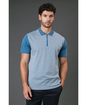 Distinctive jacquard pattern across the front body for a textured appearance
        Quarter-zip neckline with contrast tipping for a sporty finish
        Contrast solid sleeves creating a modern colour-block effect
        Ribbed collar with contrast trim for a refined touch
        Comfortable cotton fabric ideal for all-day wear
    
    This Burton jacquard polo offers a contemporary twist on a classic style. The textured pattern across the front creates visual interest whilst maintaining a sophisticated look that works perfectly for various casual occasions. Style it as shown with dark trousers and white trainers for an effortlessly smart weekend outfit, or pair with your favourite jeans for a relaxed pub lunch with mates. The quarter-zip detail adds functionality and a sporty element that nods to active lifestyles without compromising on style. Perfect for summer barbecues, casual Fridays at the office, or watching the match with friends. The contrast sleeves and collar detailing provide just enough interest to stand out from standard polos in your wardrobe, whilst the cotton construction ensures breathability and comfort throughout the day. A versatile addition to any casual wardrobe that bridges the gap between laid-back and put-together.