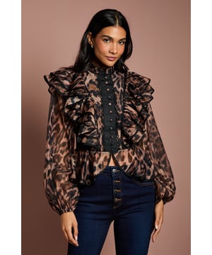 Striking leopard print organza fabric with semi-sheer finish for a luxurious look
        Elegant high neckline with button-down front detail adding sophisticated structure
        Dramatic frill detailing across the shoulders and bodice creating beautiful dimension
        Full-length balloon sleeves with gathered cuffs for a romantic silhouette
        Lined bodice ensuring comfort whilst maintaining the delicate organza appearance
    
    Make a statement at your next special occasion with this exquisitely detailed Coast blouse. The combination of bold leopard print and delicate organza creates a captivating contrast that commands attention. Style with tailored high-waisted trousers and pointed court shoes for race day sophistication, or pair with dark denim and heeled boots for an elevated evening ensemble. The structured high neck and feminine frills offer the perfect balance of drama and refinement, whilst the balloon sleeves add a contemporary touch to this occasion-ready piece. Ideal for weddings, formal gatherings or graduation celebrations where you wish to showcase individual style without compromising on elegance. Complete the look with minimal jewellery to let the blouse's intricate details truly shine.