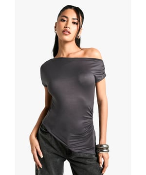 Off-shoulder design for a chic, contemporary look
        Soft, figure-hugging fabric that drapes beautifully
        Ruched detailing adds texture and interest
        Short sleeves for versatile wear
        Asymmetrical neckline creates a unique silhouette
    
    This super-soft off-shoulder top from Boohoo is the epitome of effortless style. The ruched detailing and figure-hugging fit create a flattering silhouette that's perfect for a variety of occasions. Pair it with wide-leg trousers and statement jewellery for a trendy daytime look, or dress it up with a sleek midi skirt and heels for evening drinks. The versatile design allows for easy transition from casual brunches to more upscale events. The asymmetrical neckline adds a touch of drama, making this top a standout piece in any wardrobe. Ideal for the fashion-forward woman who values both comfort and style, this top is a must-have for those who want to stay on-trend without compromising on wearability.