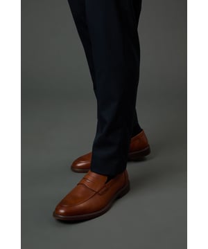 Classic penny loafer design with a sleek, modern silhouette
        Genuine leather upper for durability and a refined appearance
        Comfortable textile lining suitable for all-day wear
        Versatile tan shade that complements various outfit combinations
        Traditional slip-on style with distinctive penny slot detail
    
    These Burton penny loafers strike the perfect balance between smart and casual styling. Pair them with tailored trousers as shown for office-appropriate attire, or dress them down with chinos and a crisp button-down for weekend pub gatherings with mates. The timeless design makes these loafers particularly suitable for family occasions where you want to look presentable without appearing overdressed. For summer events, wear them with rolled-up chinos and no socks for a relaxed yet sophisticated look. During cooler months, they work brilliantly with dark jeans and a quality jumper. Their versatility extends from casual Friday at the office to Sunday roast with the family, making them an essential addition to any practical wardrobe. The comfortable construction ensures you'll remain at ease whether you're watching the match or enjoying a night out.