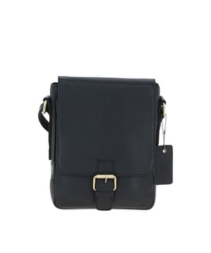 This compact leather flap over bag blends timeless craftsmanship with everyday practicality, making it ideal for city outings or casual wear. It features a spacious main compartment secured with a flap and magnetic closure, along with 2 outer zip pockets for added storage. The design is finished with elegant gold-coloured hardware and clean, structured lines. Its adjustable strap, with a drop length of 51–70 cm, offers flexibility for both crossbody and shoulder wear. Dimensions: (L) 19 cm x (W) 5.5 cm x (H) 25 cm.