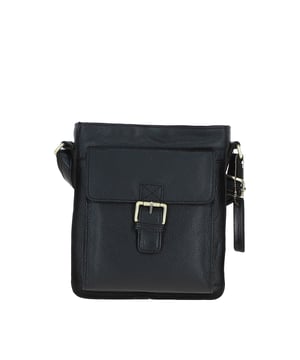 Crafted for style and convenience, this leather flap over side bag is the perfect hands-free companion for daily outings. With a spacious main compartment secured by a magnetic flap closure, it also features 2 outer pockets for quick-access items and 2 internal pockets to keep essentials organized. The gold-coloured hardware adds a refined touch, while the adjustable strap with a 35–72 cm drop length offers versatile wear as a crossbody or shoulder bag. Dimensions: 20 cm (L) x 7.5 cm (W) x 24 cm (H).
