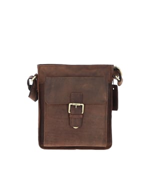 Crafted for style and convenience, this leather flap over side bag is the perfect hands-free companion for daily outings. With a spacious main compartment secured by a magnetic flap closure, it also features 2 outer pockets for quick-access items and 2 internal pockets to keep essentials organized. The gold-coloured hardware adds a refined touch, while the adjustable strap with a 35–72 cm drop length offers versatile wear as a crossbody or shoulder bag. Dimensions: 20 cm (L) x 7.5 cm (W) x 24 cm (H).