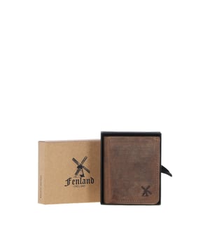 The Fenland England Leather Classic Wallet is crafted from 100% genuine leather, offering a sleek and functional design with four card slots, two bill note slots, and a convenient coin pocket. Each wallet is meticulously handcrafted for durability and a luxurious feel, with the leather aging beautifully to develop a unique patina over time. Perfect for keeping all your cards, bill notes, and coins safe, this wallet combines practicality, style, and the rich heritage of Fenland England. Presented in an elegant Fenland presentation box, it adds a touch of class to any occasion, making it an ideal gift or a refined personal accessory. Experience the elegance and craftsmanship of Fenland England today. Dimensions: (L) 10 cm x (W) 8.5 cm.