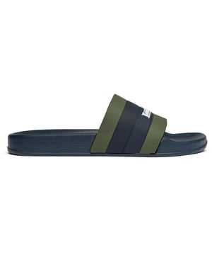 The Lambretta Prince slides bring effortless Italian style to your summer rotation. Crafted entirely in rubber with a vibrant green finish, these men's sandals feature comfortable insoles that make them perfect for poolside lounging or casual street wear. The iconic Lambretta branding adds a touch of heritage cool to this laid-back essential that transitions seamlessly from beach to city.