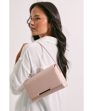 Sleek structured design for a polished look
        Versatile shoulder strap for hands-free convenience
        Elegant metal bar detail adds a touch of sophistication
        Compact size perfect for essentials
        Smooth exterior finish for a refined appearance
    
    This structured shoulder bag from Dorothy Perkins is the epitome of understated elegance. Its clean lines and compact silhouette make it an ideal companion for various occasions, from brunch with friends to evening drinks. The versatile design allows for effortless transition from day to night, complementing both casual and dressier ensembles. Style it with a chic midi dress and strappy heels for a sophisticated evening look, or pair it with tailored trousers and a blouse for a polished daytime outfit. The bag's sleek profile ensures it won't overpower your ensemble, making it a go-to accessory for the fashion-conscious woman who appreciates subtle style. Whether you're attending a baby shower or meeting friends for cocktails, this bag will add a refined touch to your outfit while keeping your essentials close at hand.