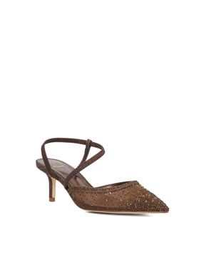Step into subtle glamour with Chasing, a refined kitten heel that brings elegance with ease. Crafted from soft leather and finished in a shimmering fabric, this sleek style features a pointed toe and an asymmetric elasticated strap that gracefully curves around the ankle for a secure and flattering fit. Perfect for both occasion dressing and elevated everyday wear, Chasing adds a polished, contemporary touch to every step.