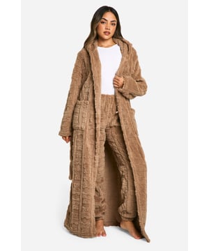 Luxuriously soft fleece fabric with embossed bear print
        Full-length design for maximum coverage and warmth
        Cosy hood for added comfort
        Practical side pockets for convenience
        Adjustable belt to cinch in the waist
    
    Wrap yourself in ultimate comfort with this charming embossed bear print dressing gown. Perfect for those lazy mornings or cosy nights in, this full-length robe offers both style and functionality. The soft fleece fabric envelops you in warmth, while the hood provides an extra layer of snugness. Side pockets offer practicality for keeping your hands warm or storing small essentials. The adjustable belt allows you to customise the fit to your liking, creating a flattering silhouette. Whether you're enjoying a cup of tea on the sofa or preparing for a relaxing night's sleep, this dressing gown is your go-to for luxurious loungewear. Pair with your favourite pyjamas or nightdress for a complete bedtime ensemble that's both fashionable and comfortable.