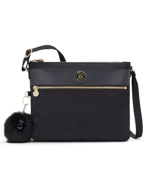 The Kipling Ambrosia Women's Black Crossbody Bag is a chic and functional accessory designed for women who value both style and practicality. This versatile crossbody bag is perfect for everyday use, offering ample storage while maintaining a sleek and minimalist design.
Key features:
Sleek Crossbody Design: 

The Ambrosia features a compact and stylish crossbody design, making it ideal for hands-free convenience. The adjustable strap allows you to wear it comfortably across your body or over your shoulder.

Durable Nylon Fabric: 

Made from Kipling’s signature, lightweight, and water-resistant nylon, this bag is durable, easy to clean, and built to withstand daily wear and tear. The fabric ensures your bag remains in great condition for long-term use.

Organized Interior: 

The Ambrosia offers a well-organized interior with multiple compartments, including zippered and slip pockets, to keep your essentials such as your phone, wallet, keys, and makeup neatly arranged and easy to access.

Timeless Black Color: 

The black color of this bag adds a sophisticated touch, making it a versatile accessory that pairs well with almost any outfit. Whether for work, travel, or casual outings, this classic color ensures it complements a variety of looks.

Kipling Monkey Keychain: 

Like many Kipling bags, the Ambrosia features the iconic Kipling monkey keychain, adding a playful and recognizable detail to the design.

Zippered Closure: 

The main compartment of the bag is secured with a zipper, ensuring that your belongings stay safe and secure while you're on the move.

Lightweight and Comfortable: 

The lightweight construction of the bag ensures it is comfortable to carry, even for extended periods. The adjustable crossbody strap provides a customizable fit for added convenience.

The Kipling Ambrosia Women's Black Crossbody Bag is the ideal choice for women seeking a versatile, stylish, and functional bag. Whether you're running errands, going to work, or enjoying a day out, this crossbody bag offers the perfect combination of practicality and modern design.
